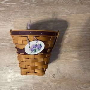 Longaberger Small waste basket‎ blooms 
9” tall  4.5” wide on B8
